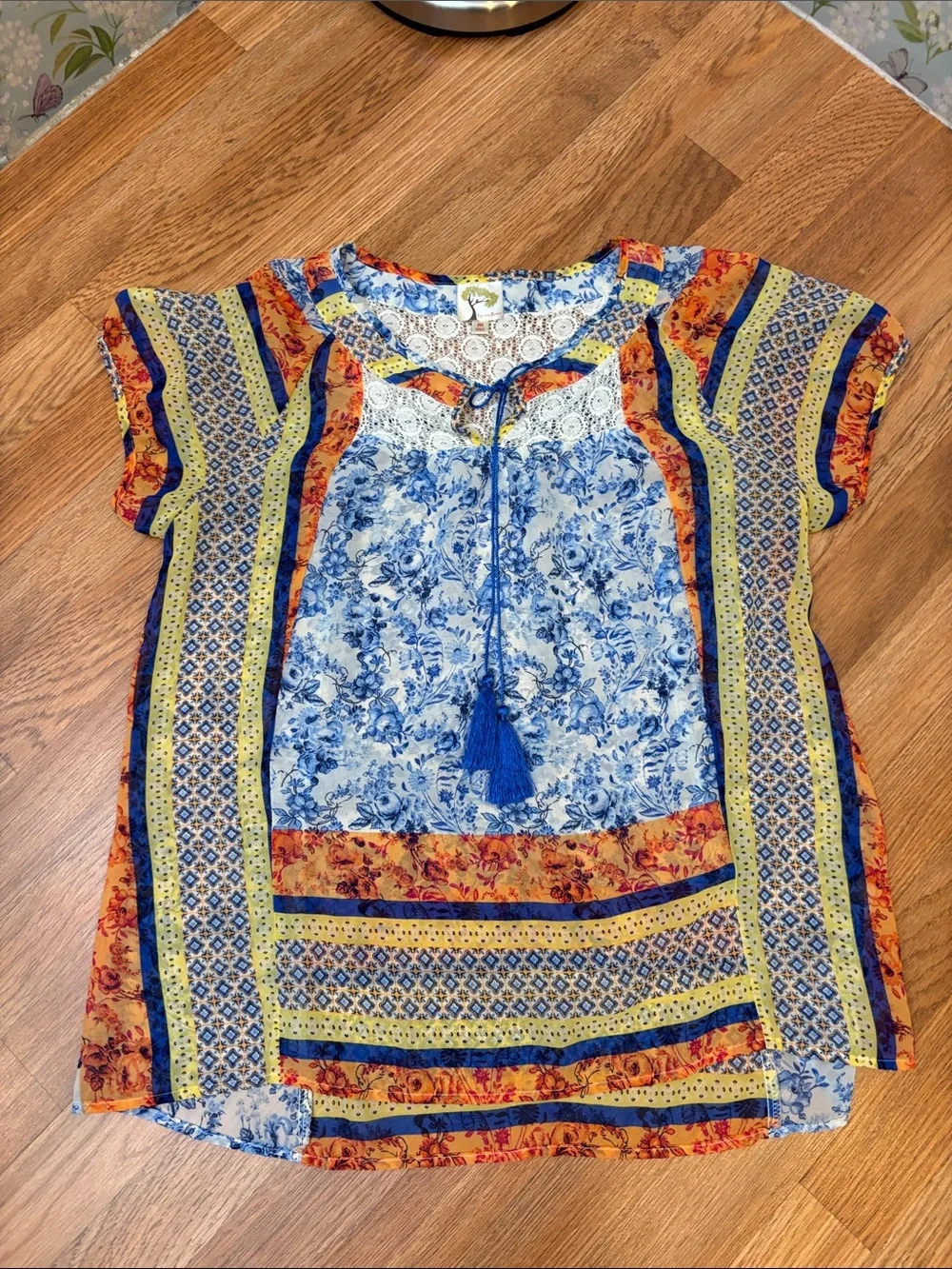 Fig & Flower blue, yellow & orange short sleeve semi-sheer top. Size M.